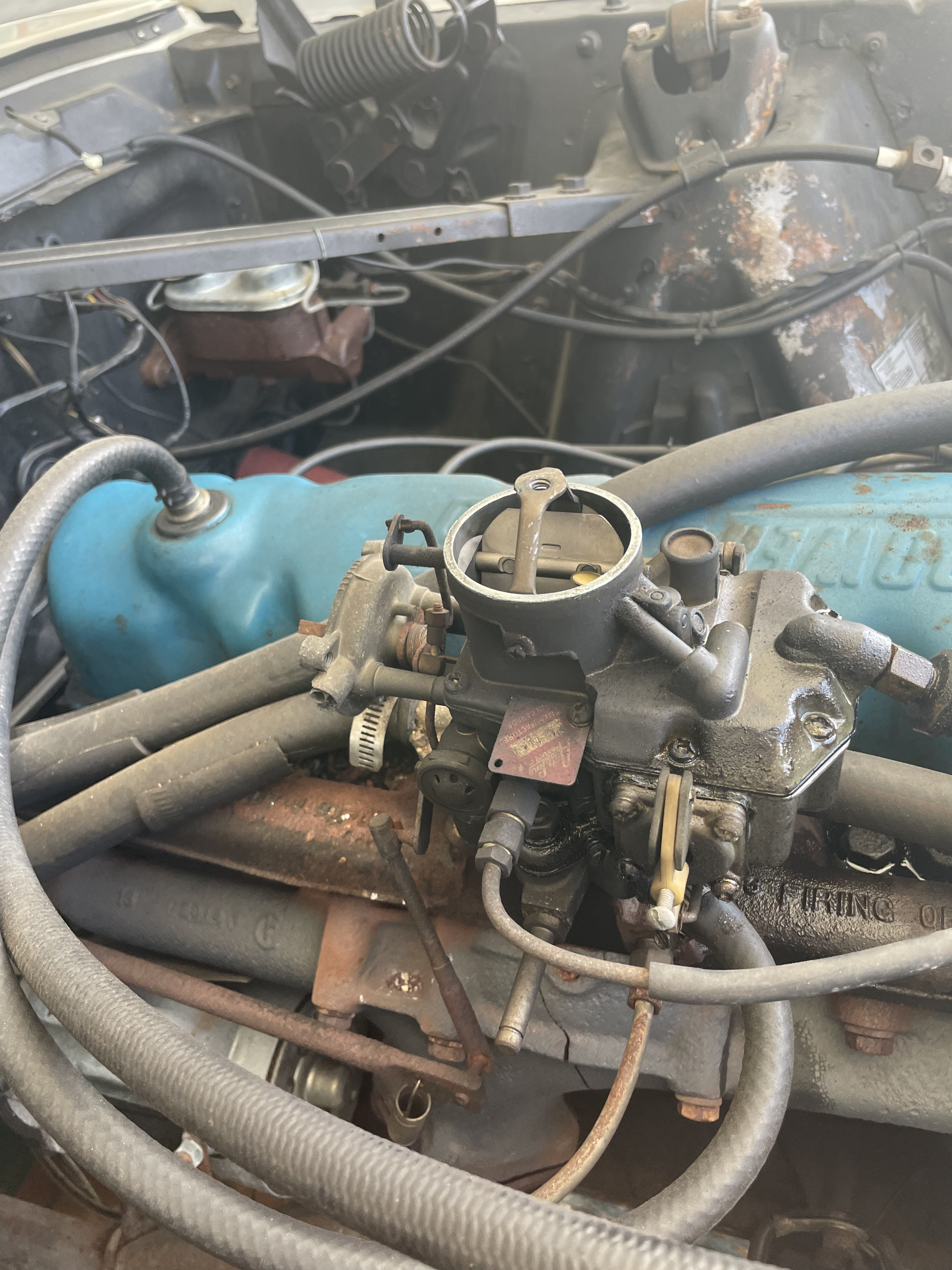 Picture of old carburetor with the air cleaner mounting bracket