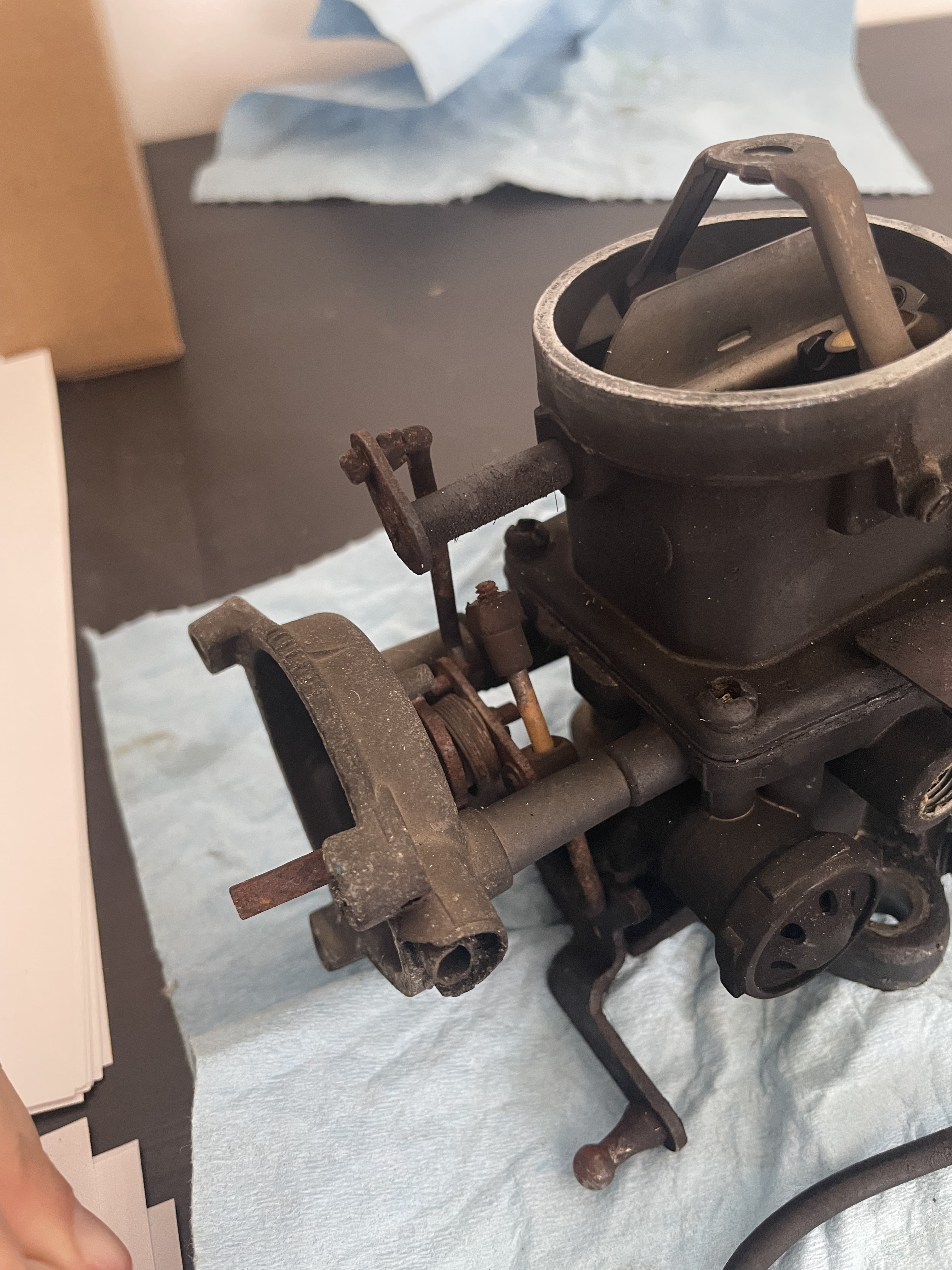 Old carb with throttle ball at bottom-middle of image